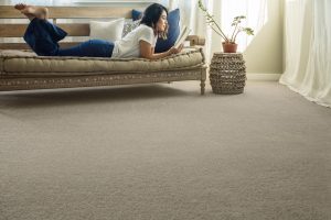 Woman reading book | Flooring Concepts