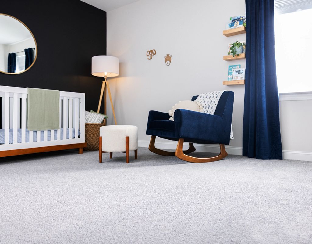 Blue chair on white carpet | Flooring Concepts